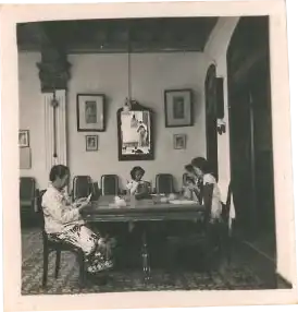 The Family At Home Nya (mother) loved to sew while the children did their homework.